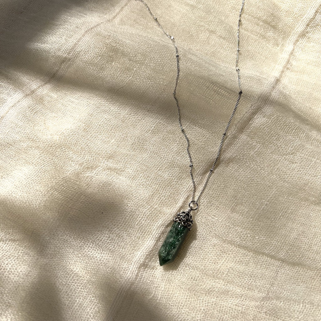 Green aventurine crystal pendant necklace with silver-tone chain and ornate cap detail