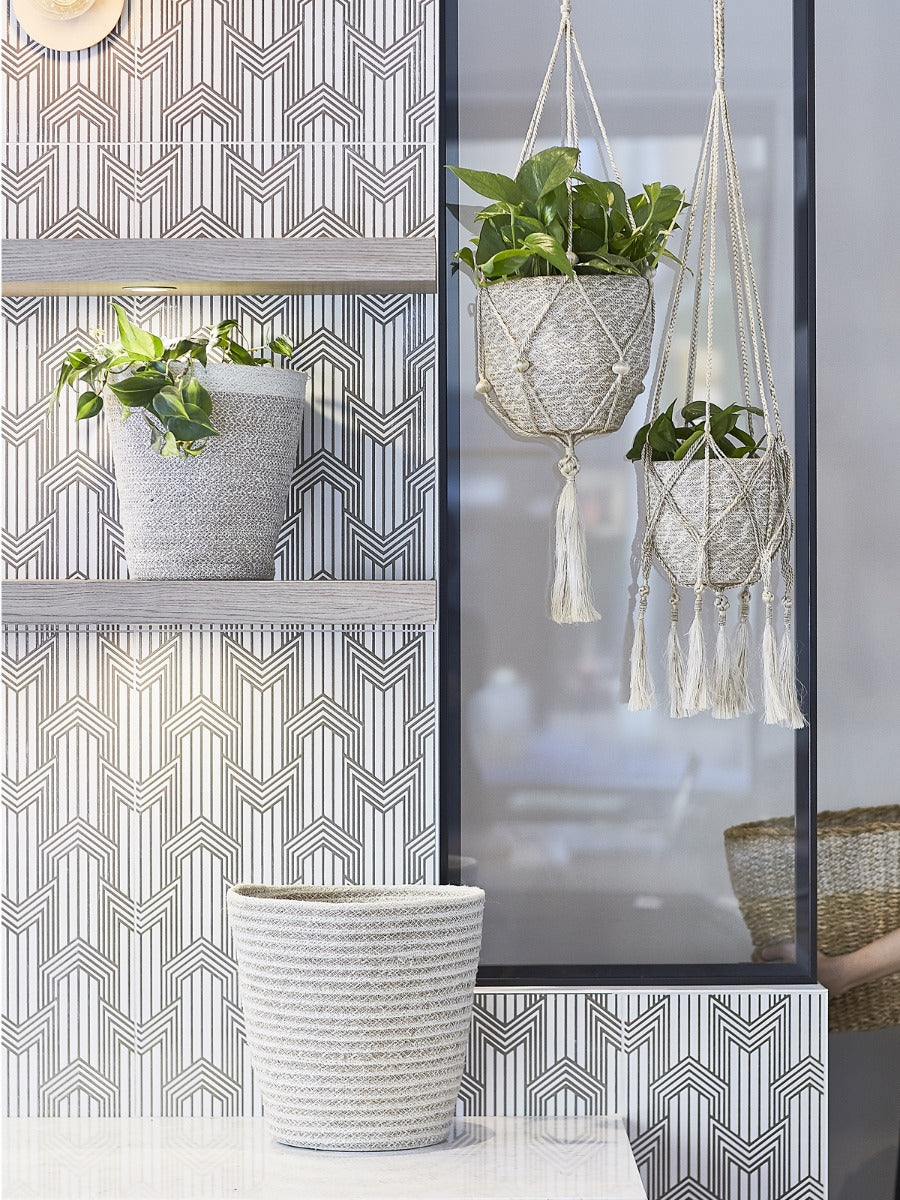 Cream jute storage bin with natural fiber texture and woven spiral pattern, plant decor basket for home organization