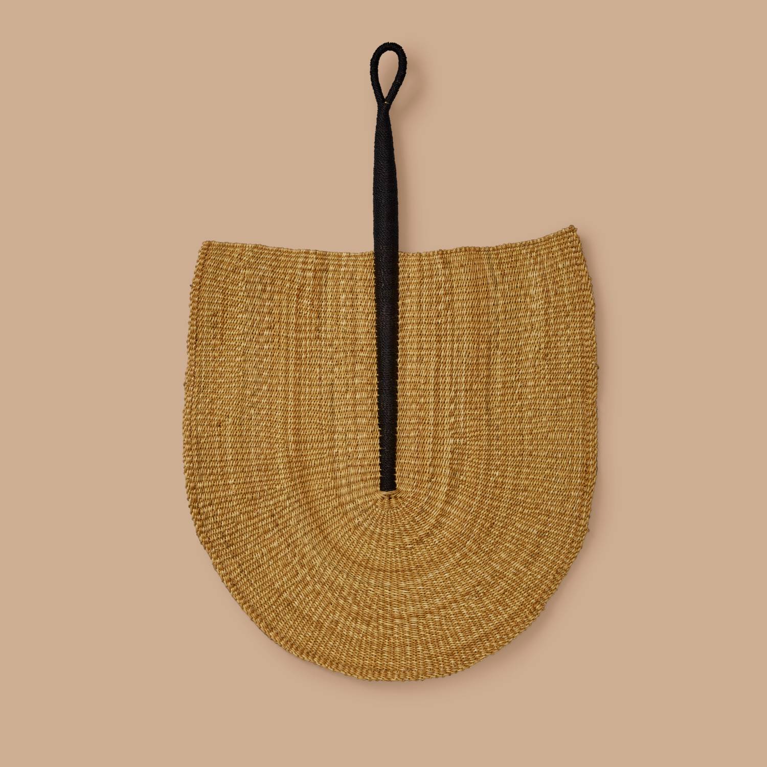 Natural woven fan with black handle, handcrafted straw decorative accessory for sustainable home decor