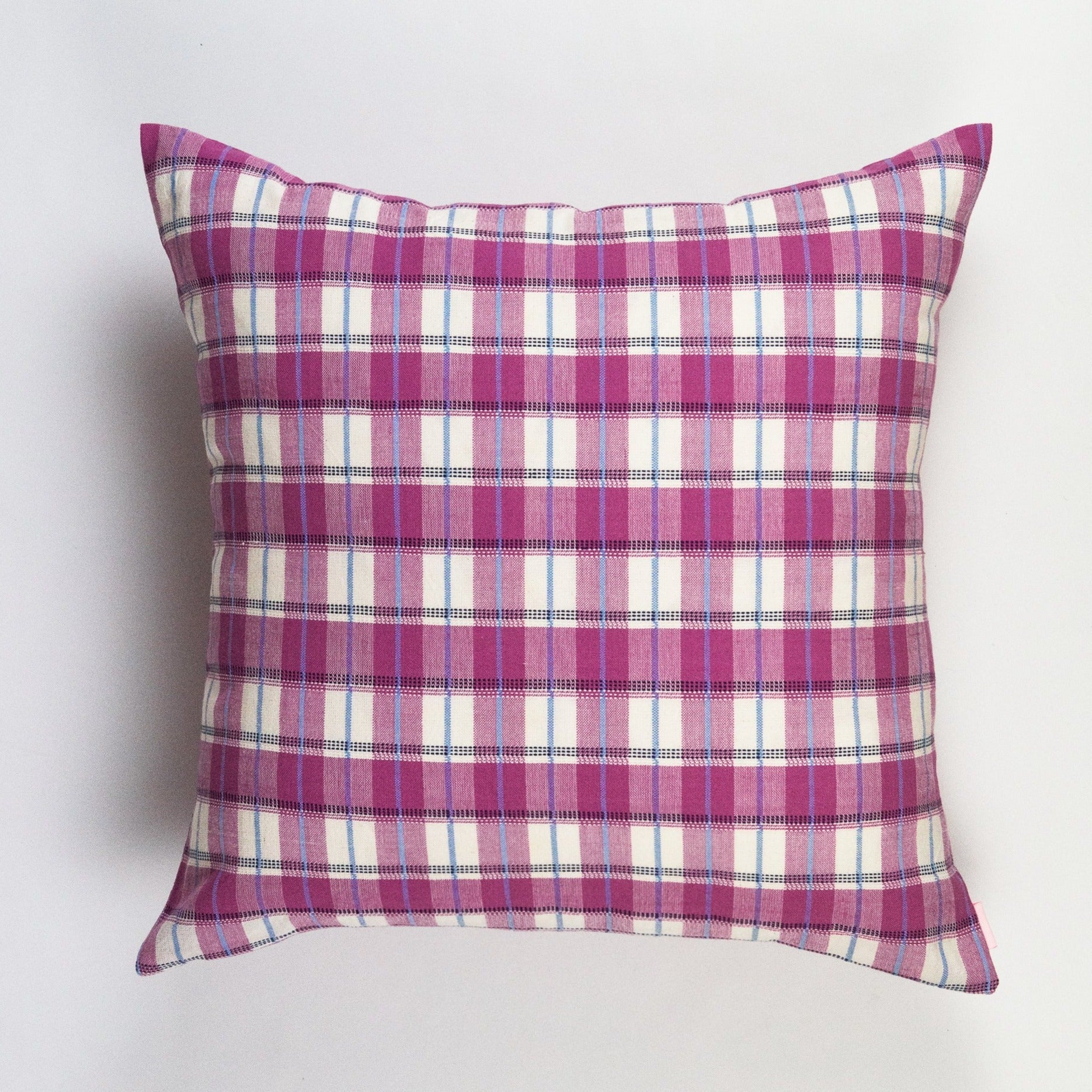 Pink and white gingham plaid throw pillow with blue accent stripes and woven cotton texture