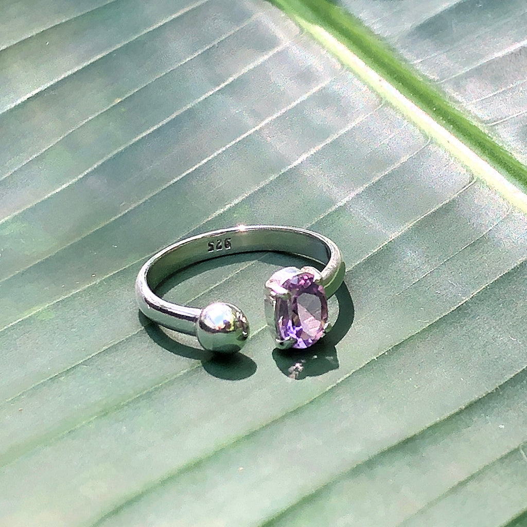 Sterling silver ring with purple amethyst stone and polished ball accent, minimalist jewelry design