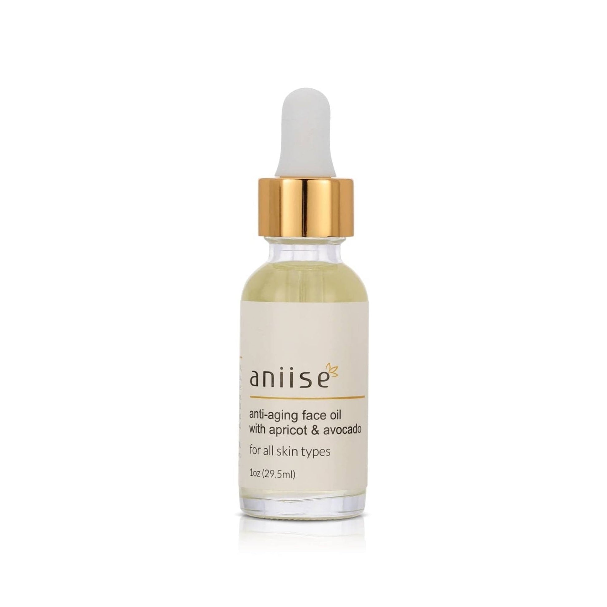 Anti-aging face oil with apricot and avocado in glass dropper bottle with gold cap