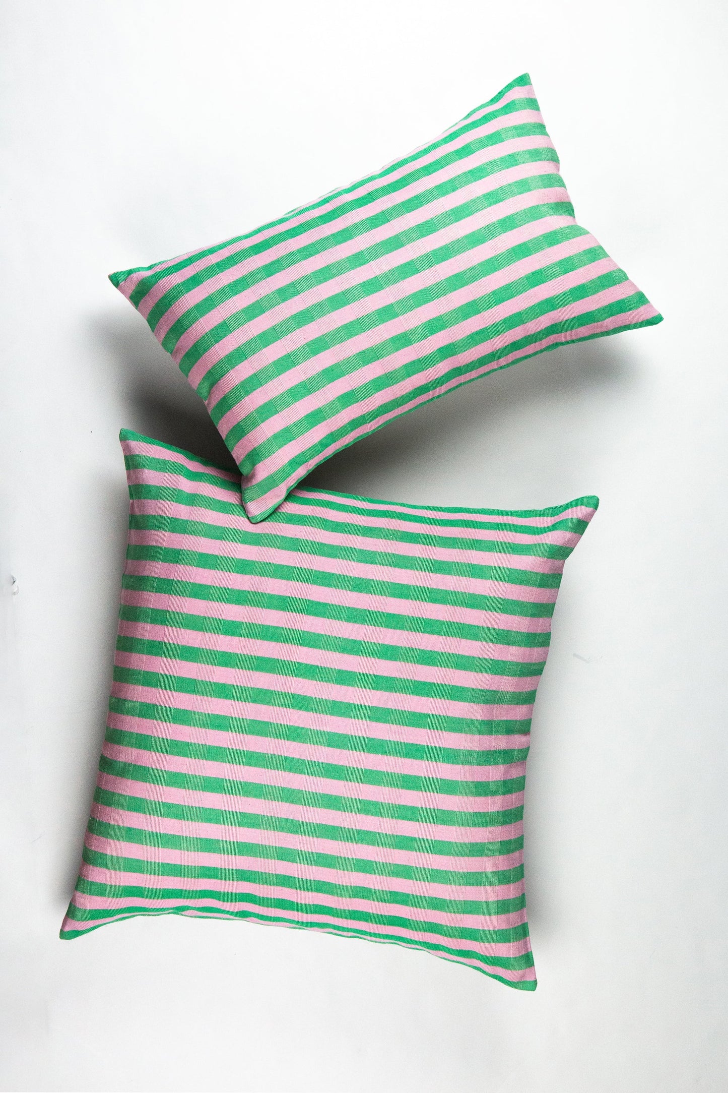 Green and pink striped pillows with textured linen fabric, sustainable home decor throw pillows