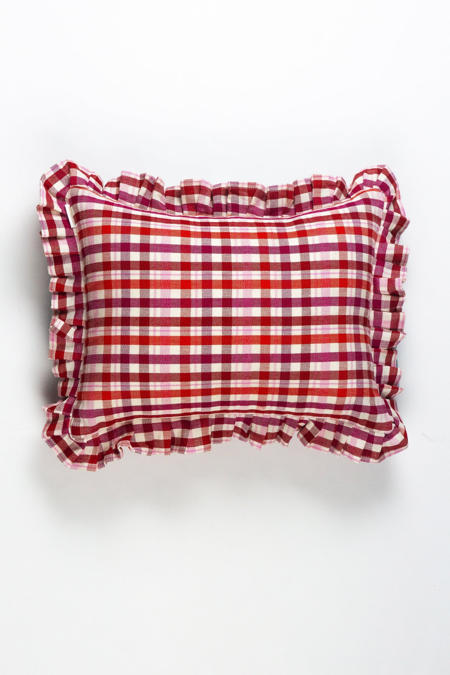 Red and white gingham plaid pillow with ruffled edges and mixed burgundy accent stripes