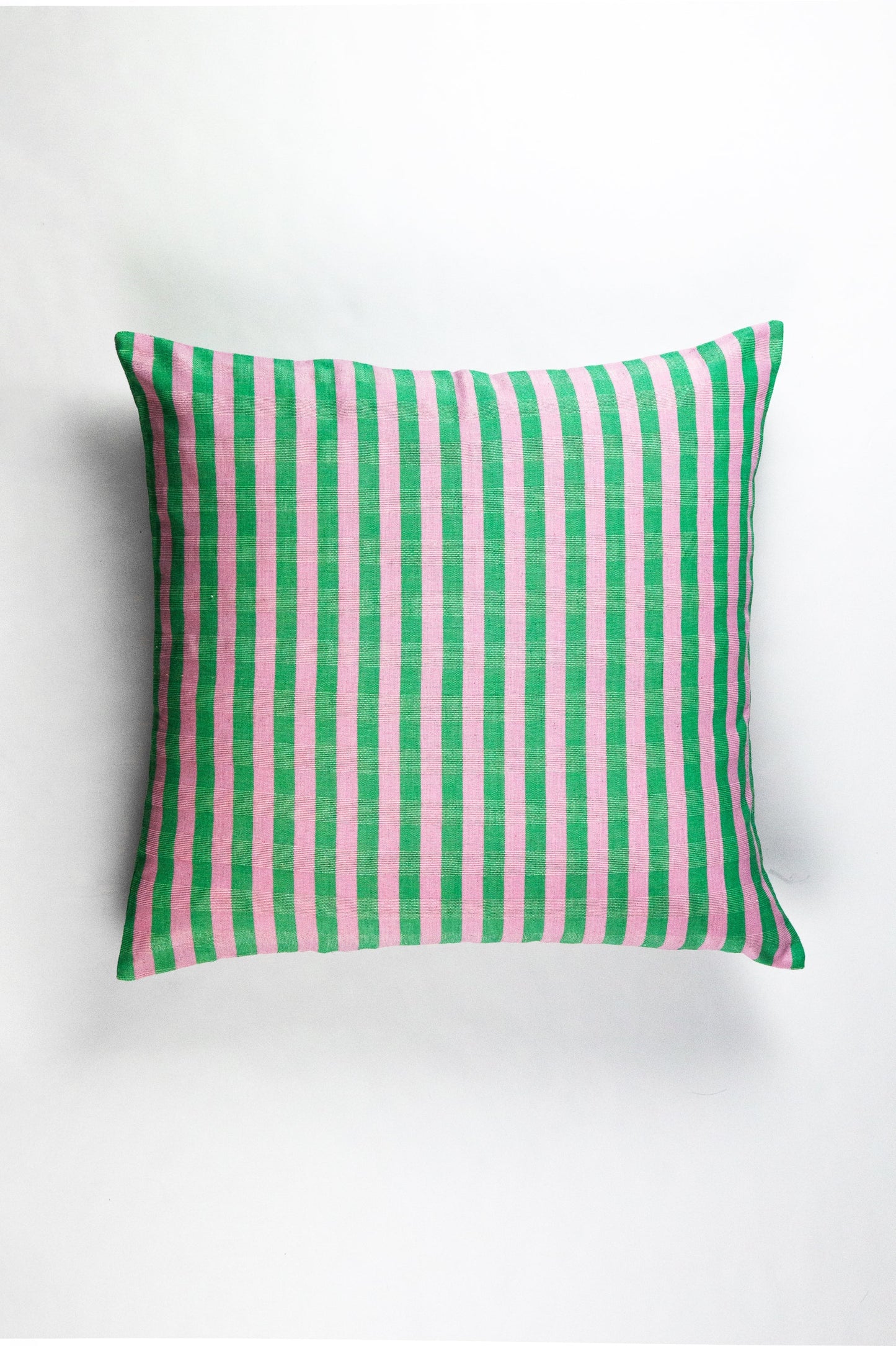 Green and pink striped organic cotton pillow with vertical texture pattern for sustainable home decor