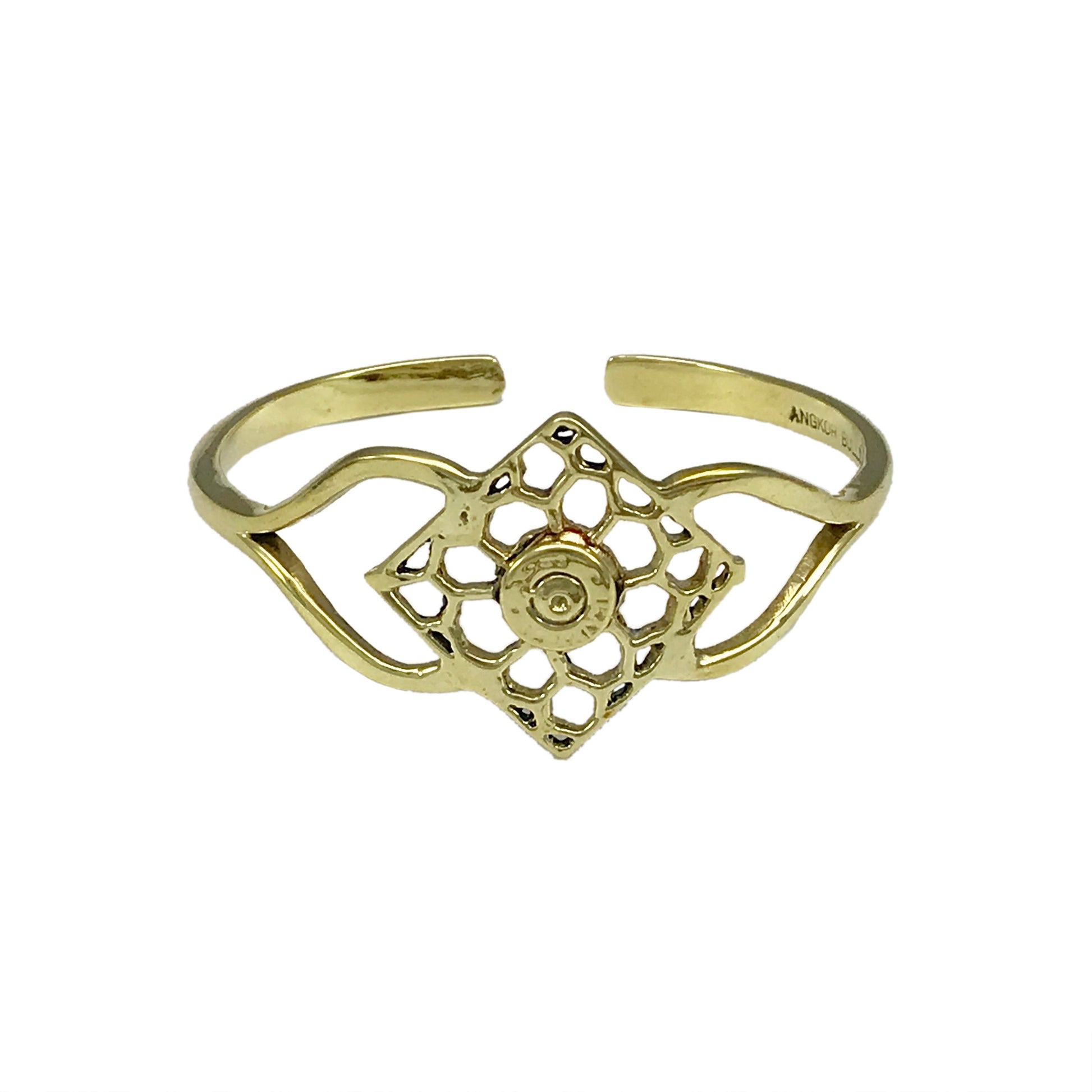 Gold cuff bracelet with ornate mandala-inspired filigree centerpiece and curved open design