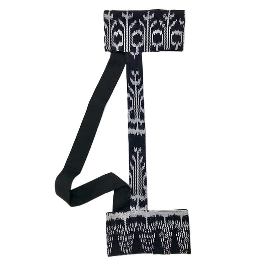 Black knit yoga mat sling with white botanical jacquard pattern and adjustable shoulder straps