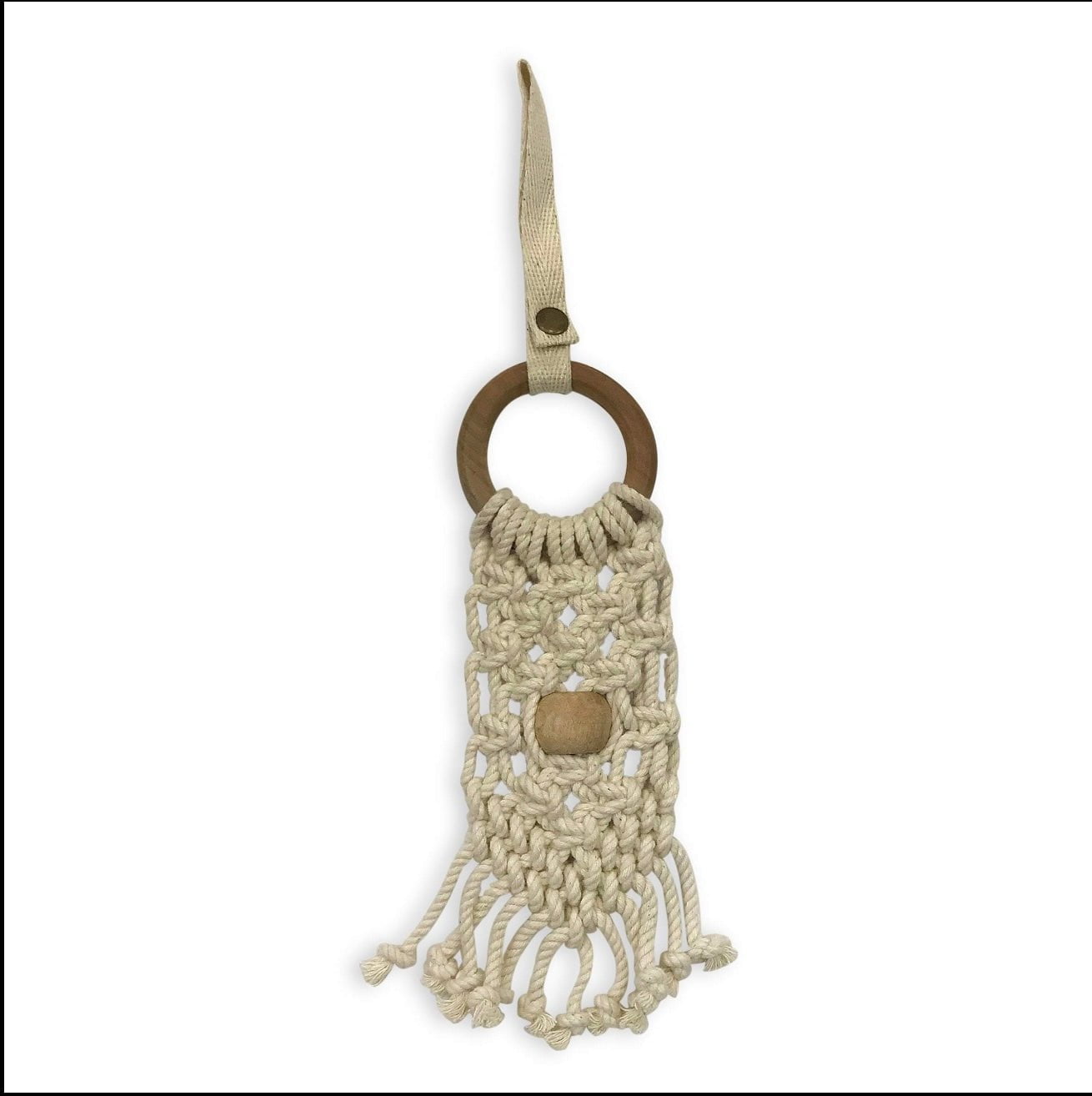 Macrame pet toy with natural cotton rope, wooden ring, and tassel fringe detail in cream and tan