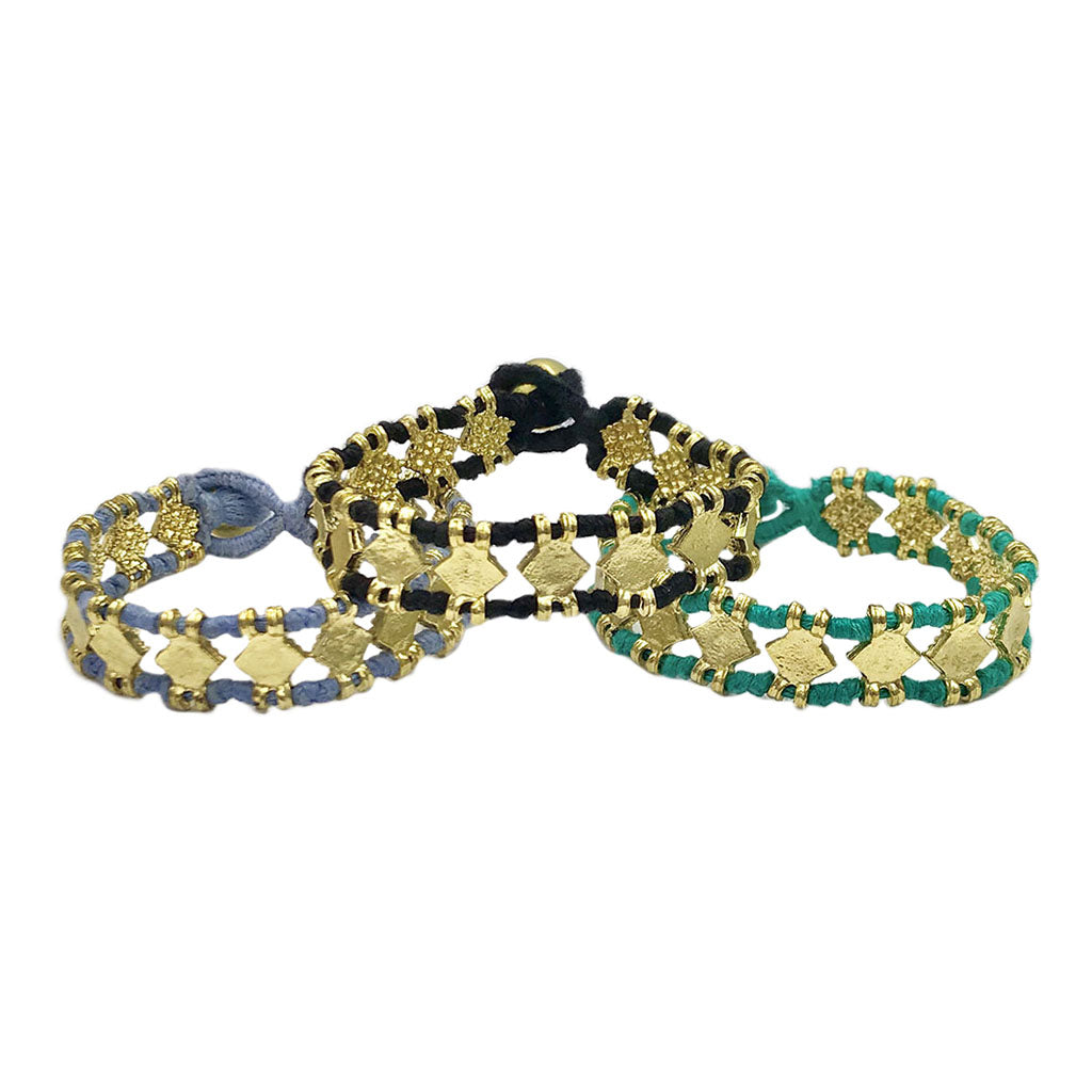 Set of three woven thread bracelets with gold charms in blue, black, and teal colorways